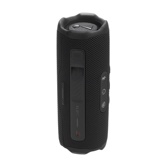 JBL Flip 7 vista trasera negra, rejilla y logo